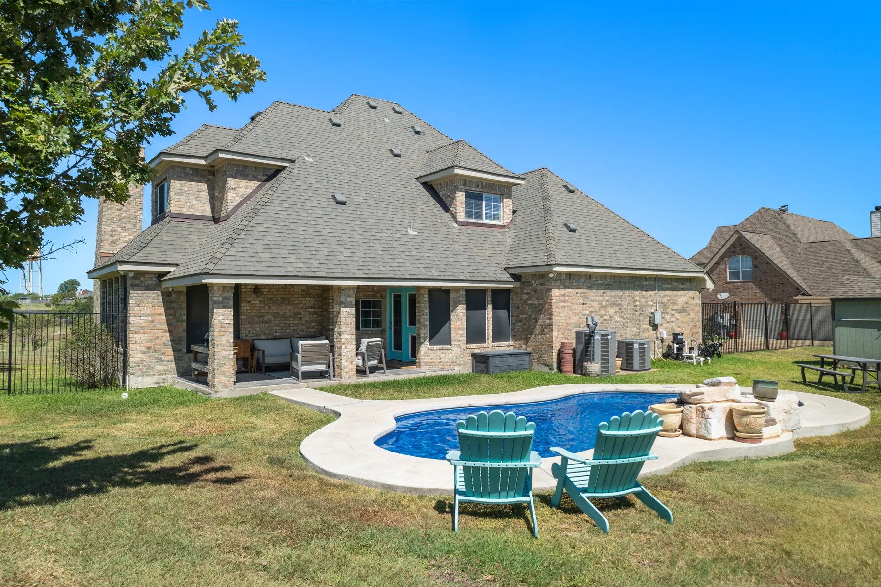 Rear exterior with pool and outdoor seating