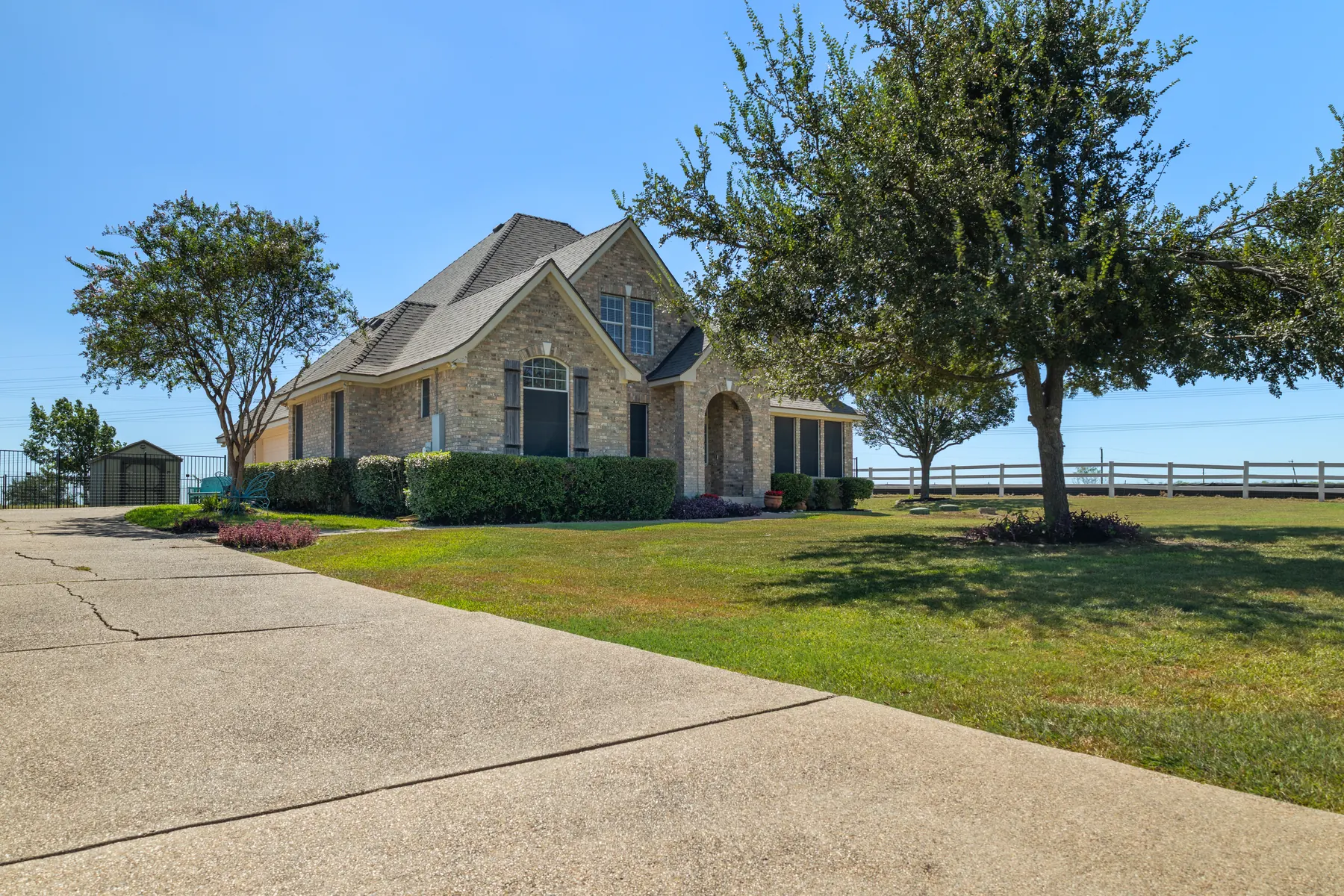 Angled exterior view across the front lawn