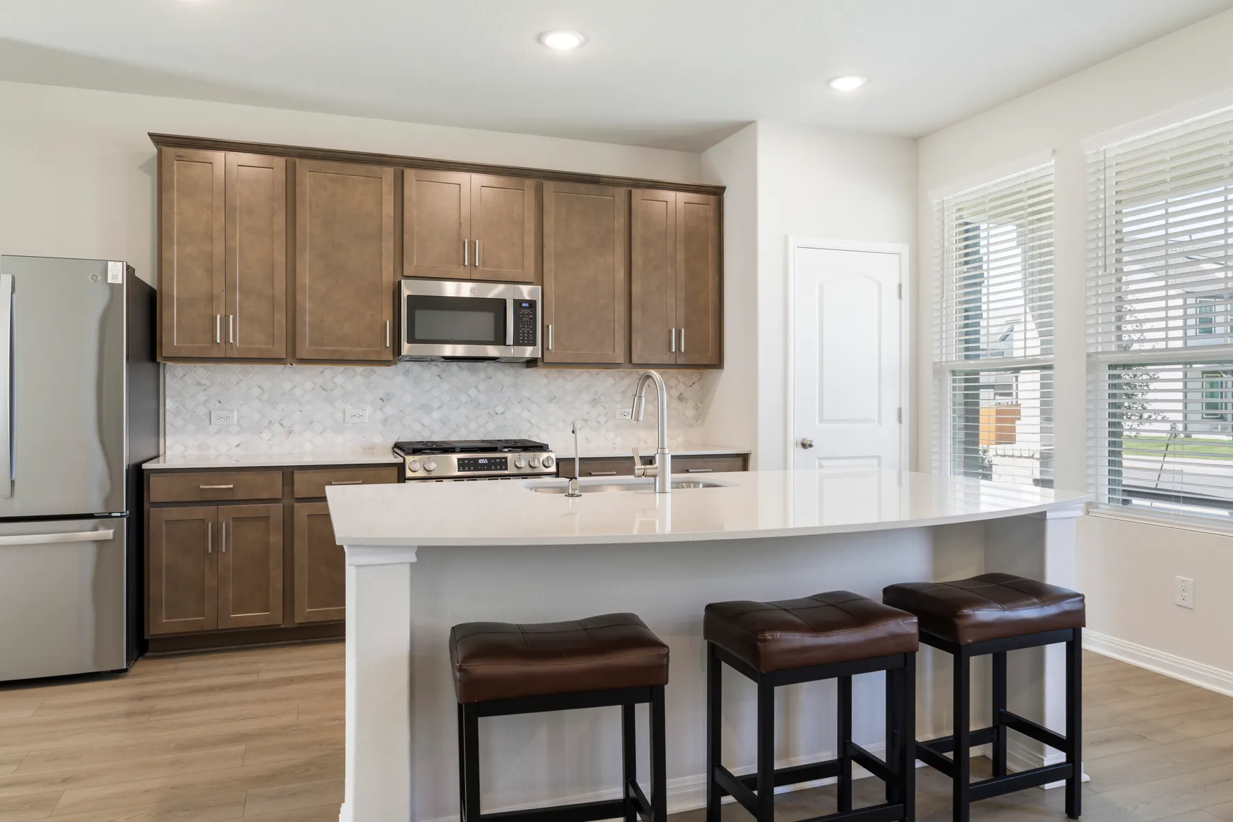Kitchen cabinetry and stainless appliances