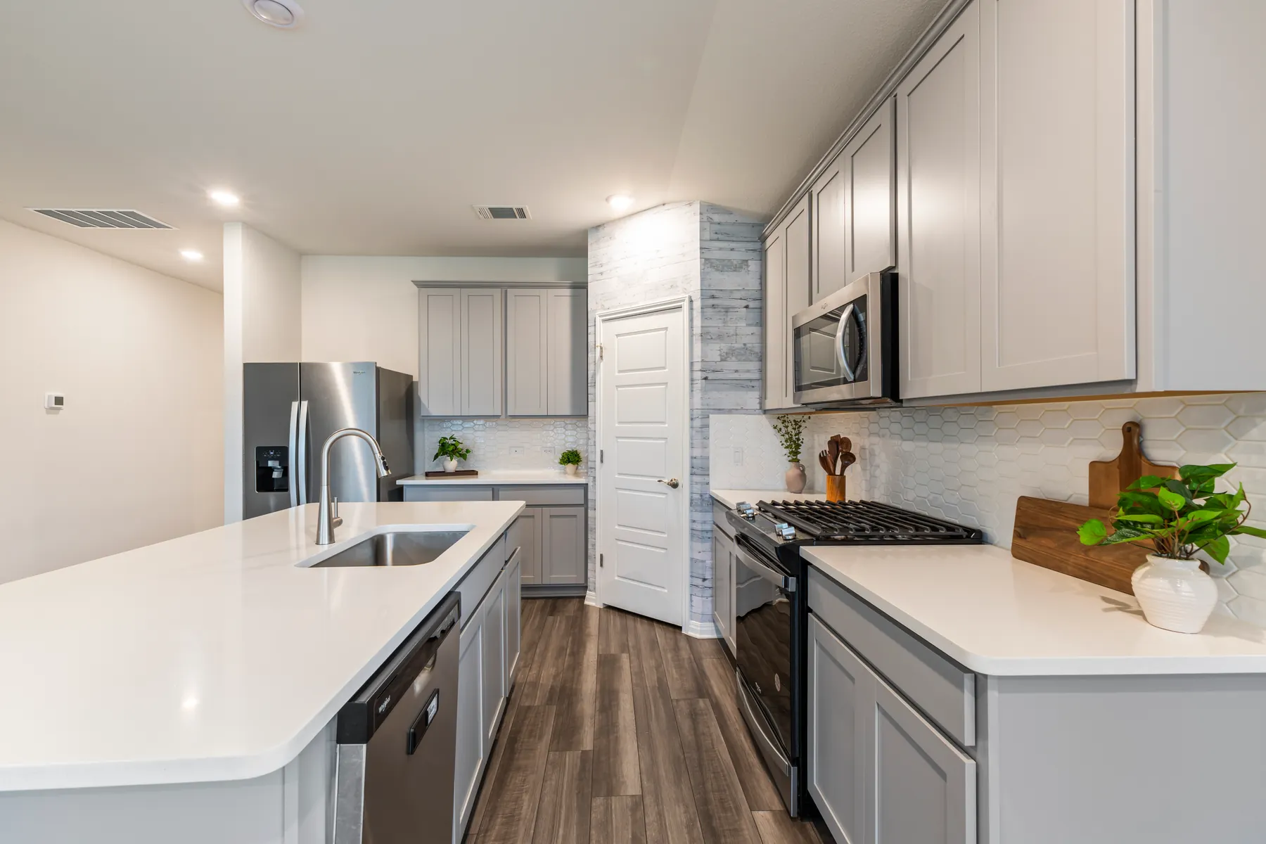 Kitchen island and stainless appliances